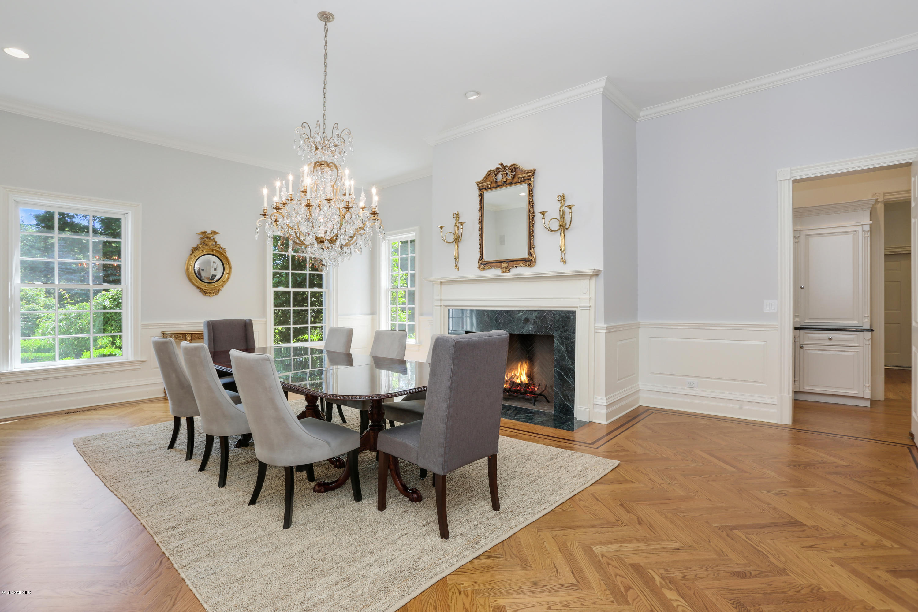 15 Knollwood Drive Greenwich, CT 06830 - Photo 5 of 30 a dining room with furniture a chandelier and wooden floor