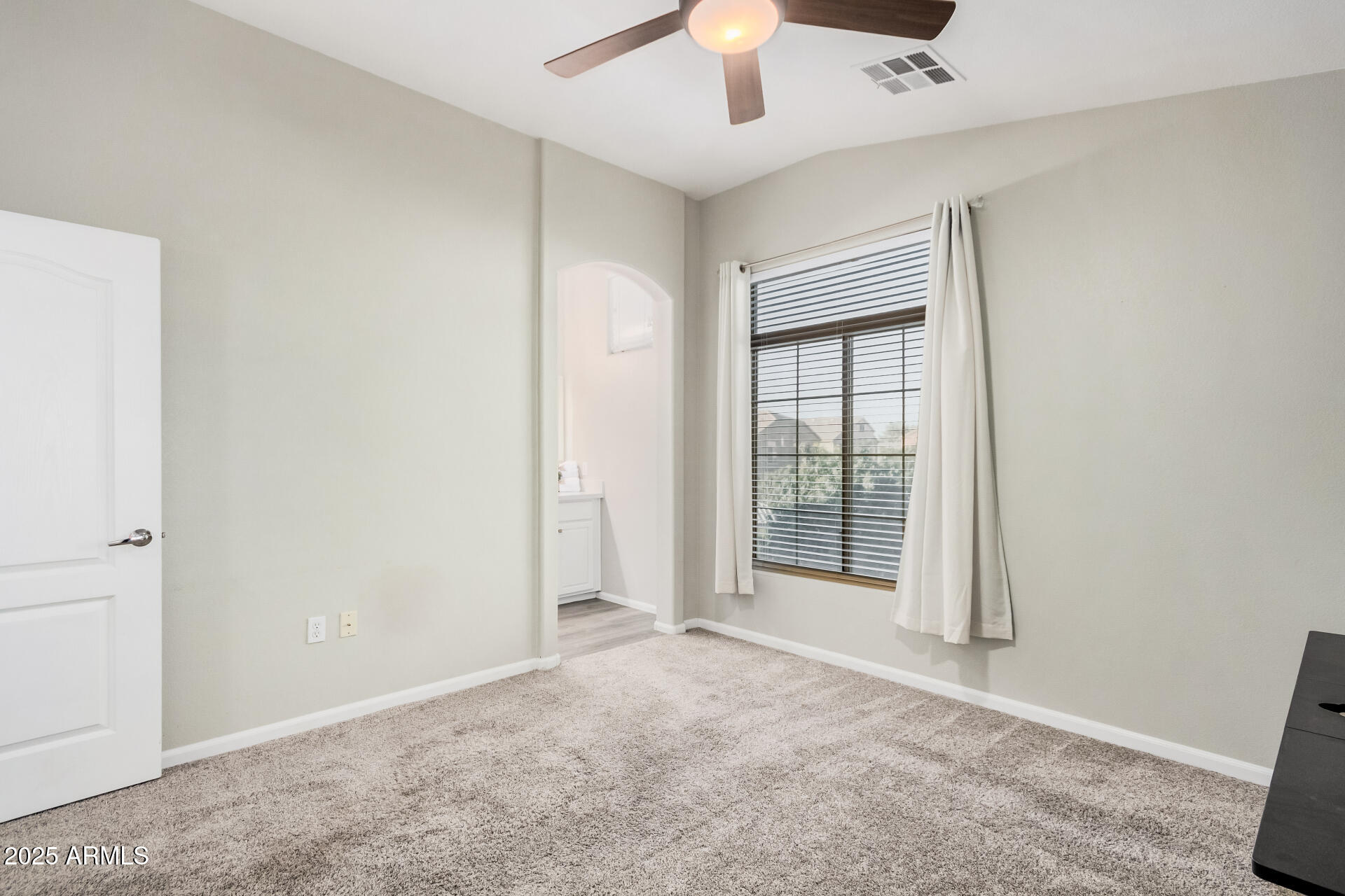 1350 South Greenfield Road, Unit 1046 Mesa, AZ 85206 - Photo 18 of 35 an empty room with windows and closet