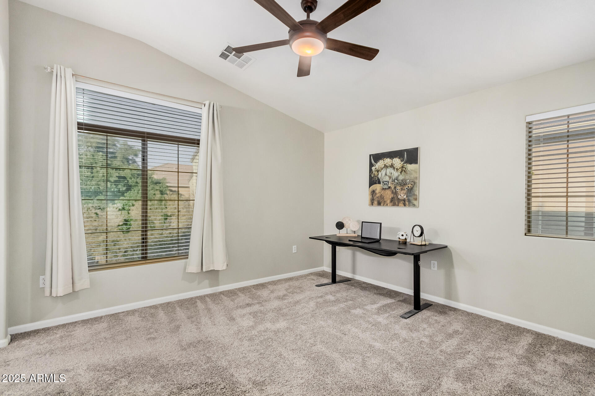 1350 South Greenfield Road, Unit 1046 Mesa, AZ 85206 - Photo 19 of 35 a view of a livingroom with a ceiling fan and a window