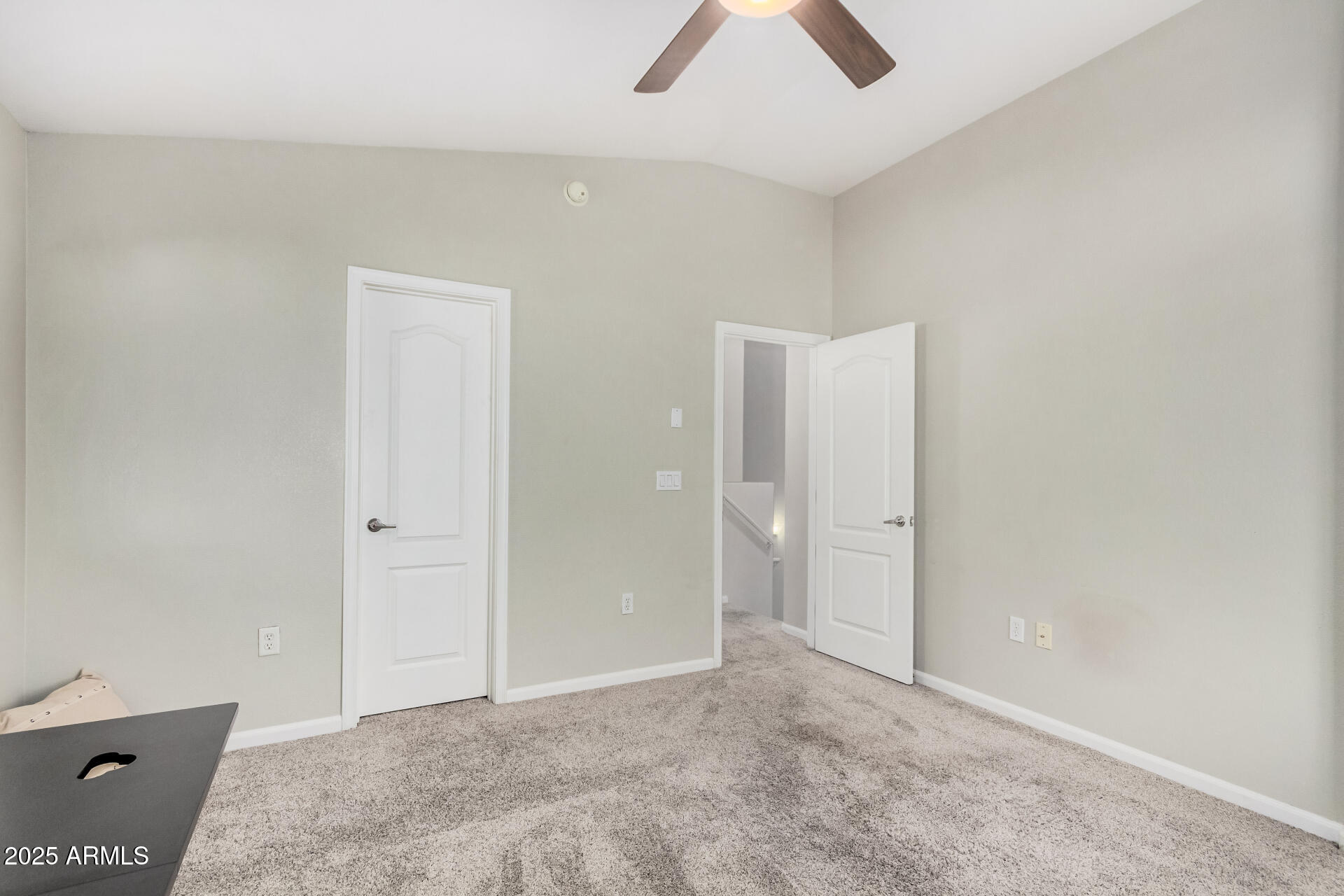 1350 South Greenfield Road, Unit 1046 Mesa, AZ 85206 - Photo 20 of 35 an empty room with chandelier fan