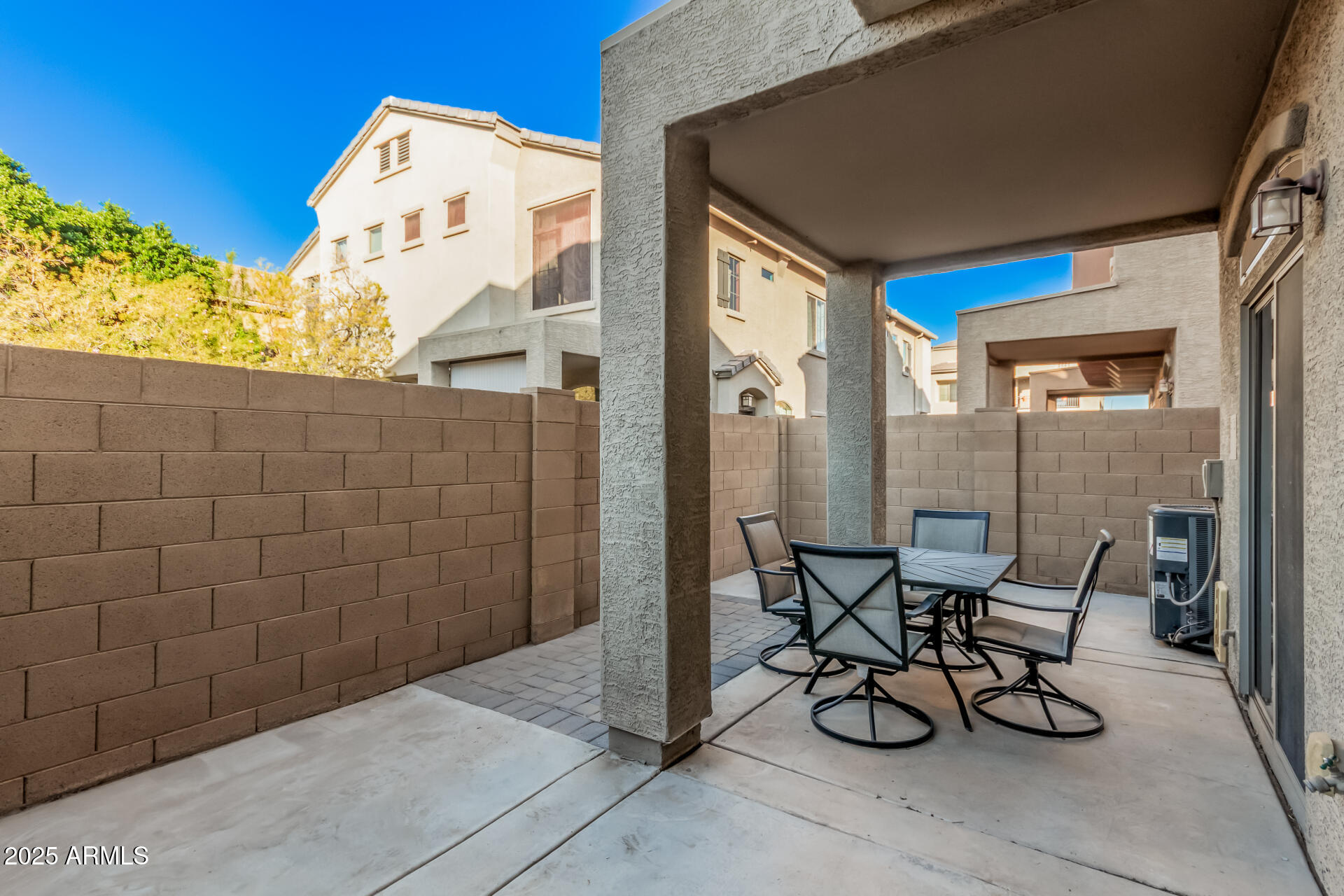 1350 South Greenfield Road, Unit 1046 Mesa, AZ 85206 - Photo 27 of 35 a view of a patio with table and chairs and potted plants