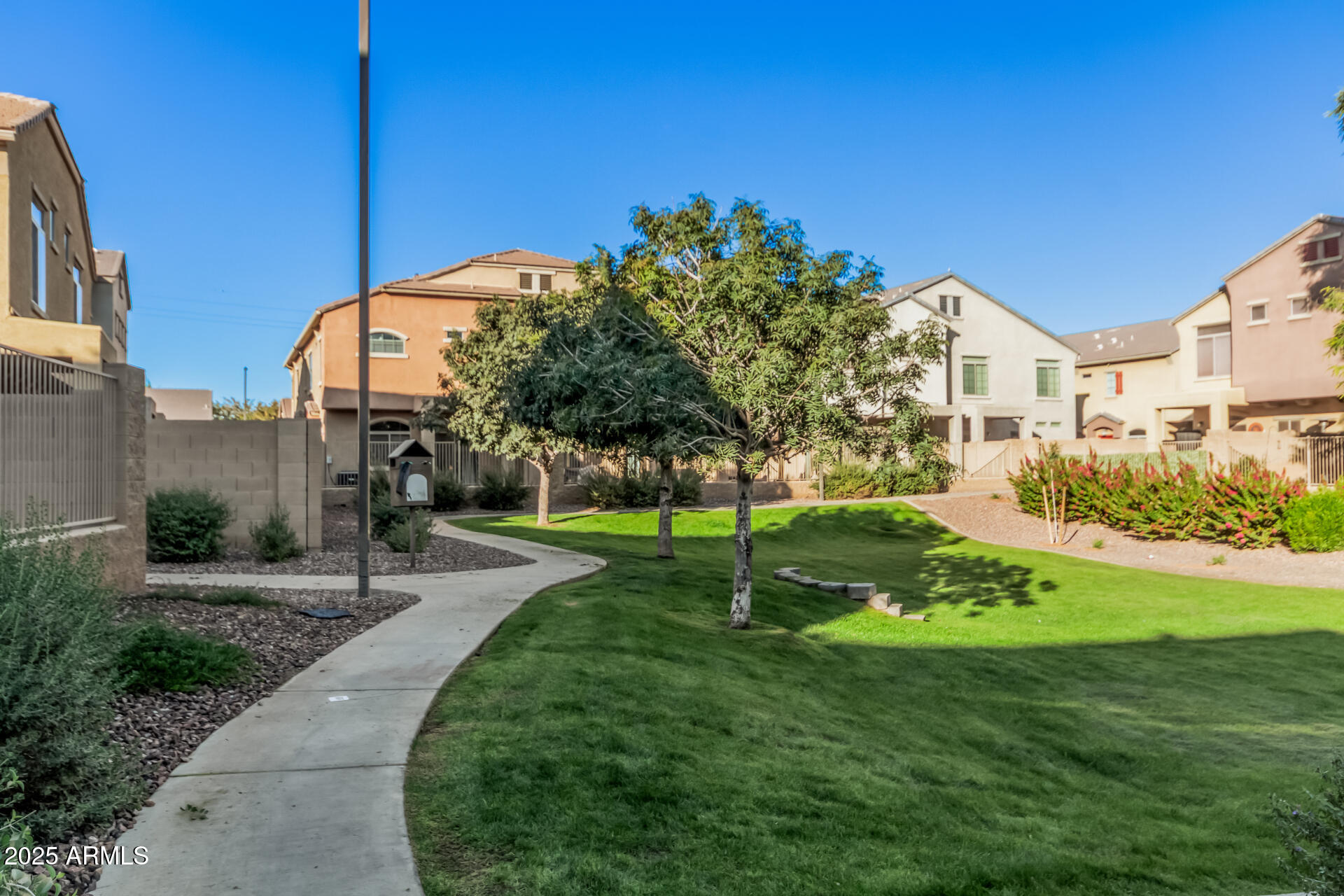 1350 South Greenfield Road, Unit 1046 Mesa, AZ 85206 - Photo 32 of 35 a view of a street with a building in the background