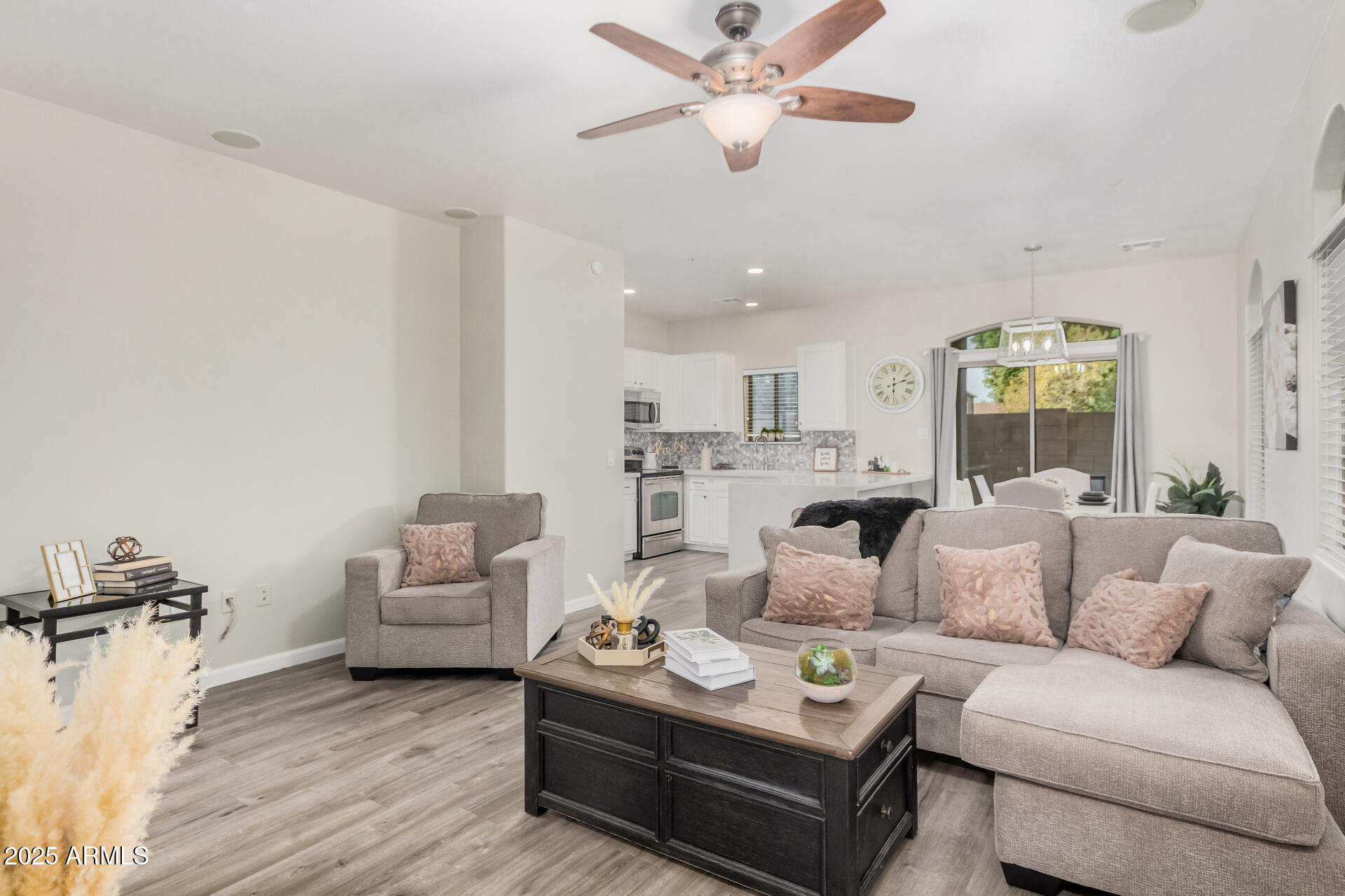 1350 South Greenfield Road, Unit 1046 Mesa, AZ 85206 - Photo 4 of 35 a living room with furniture and a large window