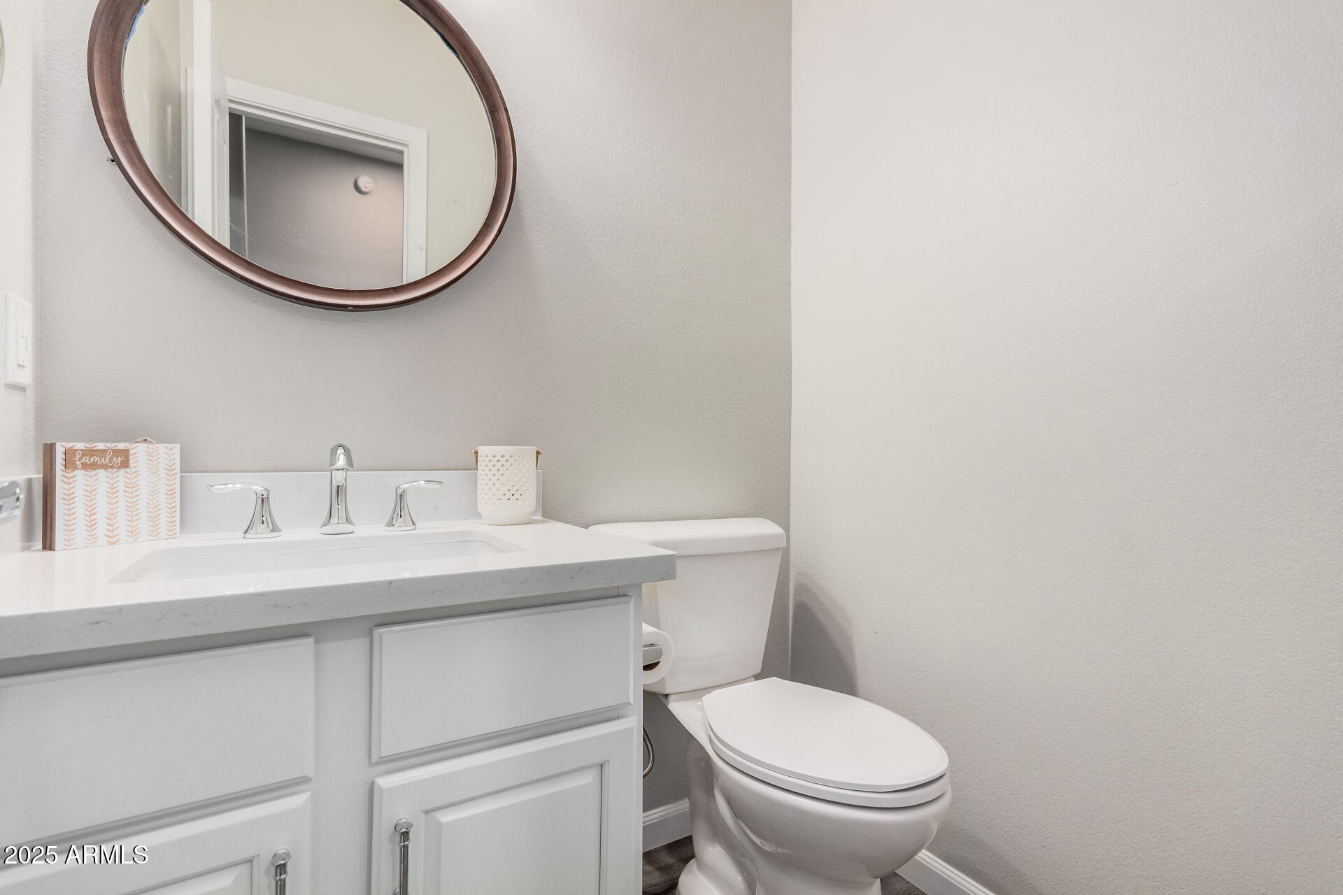 1350 South Greenfield Road, Unit 1046 Mesa, AZ 85206 - Photo 6 of 35 a bathroom with a toilet a sink and a mirror