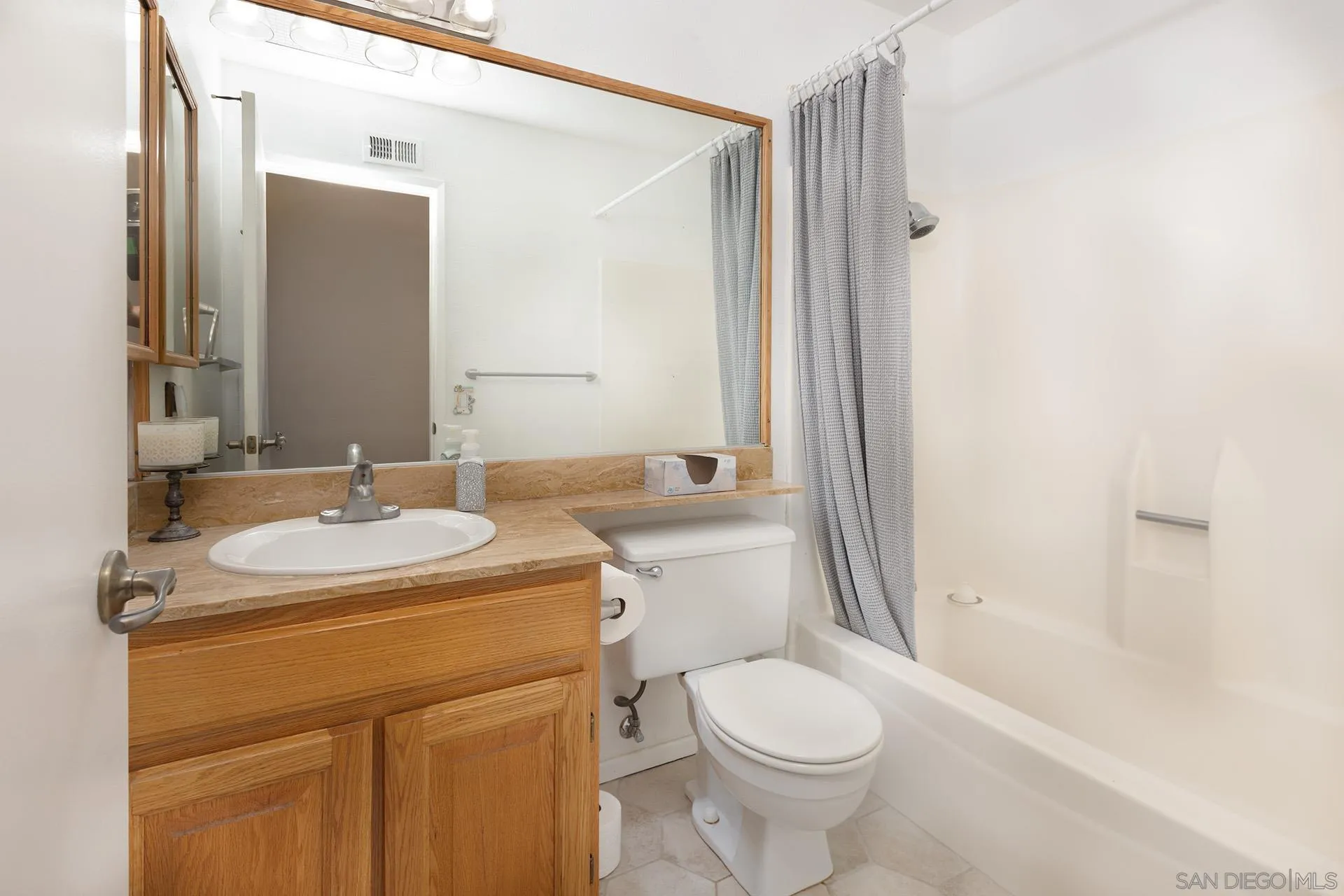 12455 Ridgeton Drive Lakeside, CA 92040 - Photo 11 of 31 a bathroom with a sink toilet and shower
