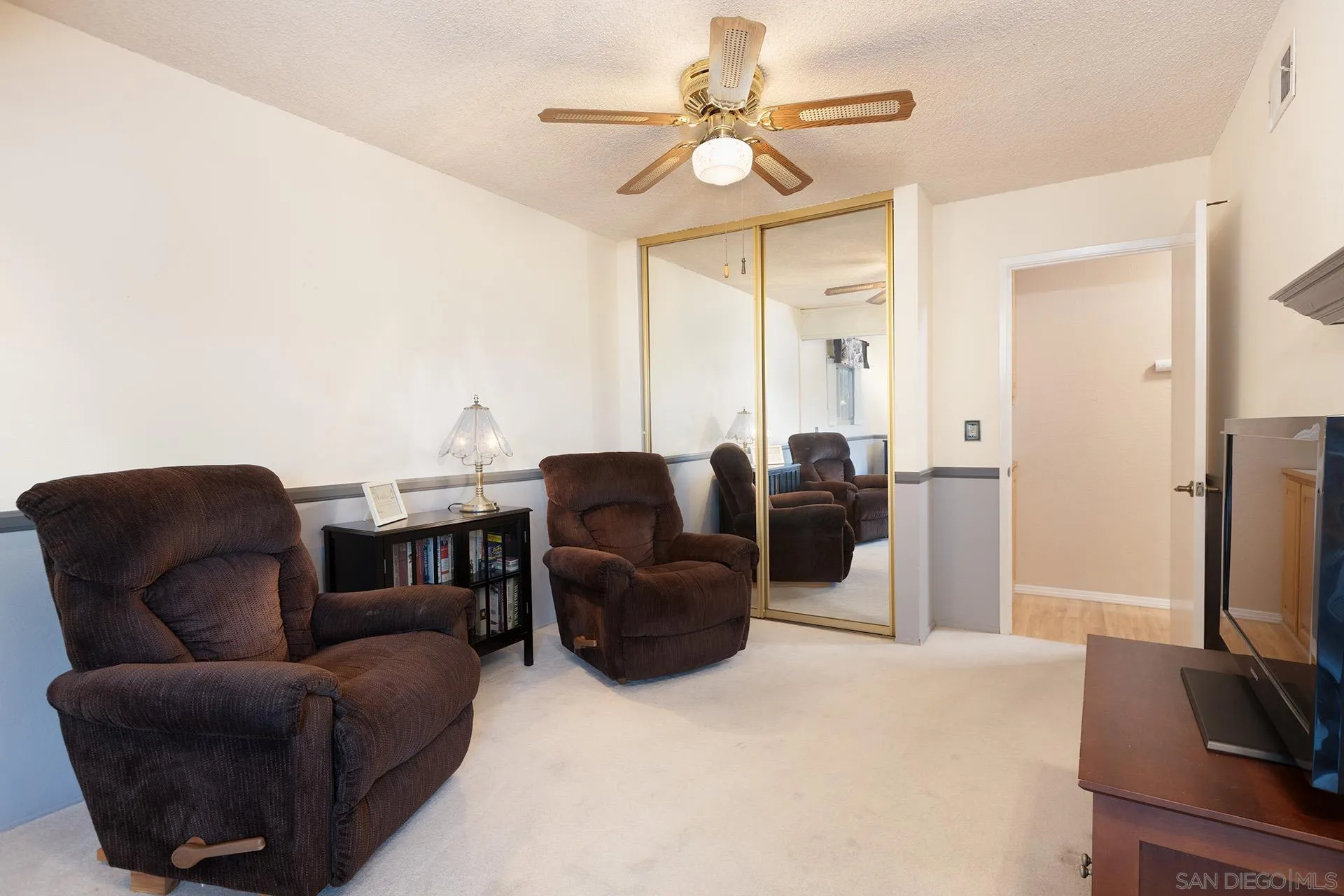 12455 Ridgeton Drive Lakeside, CA 92040 - Photo 18 of 31 a living room with furniture a flat screen tv and a window