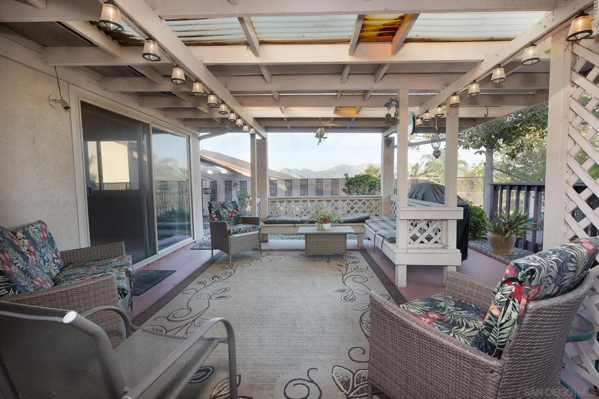 12455 Ridgeton Drive Lakeside, CA 92040 - Photo 19 of 31 a living room with patio furniture and a floor to ceiling window