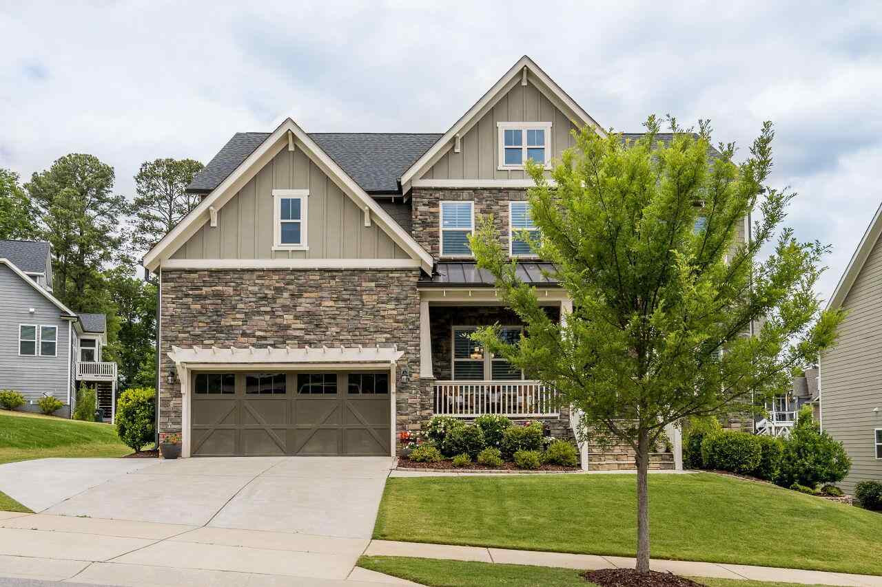 5268 Aleppo Lane Raleigh, NC 27613 - Photo 2 of 30 Stone front with covered front porch make this home stunning and classic! Exterior Front