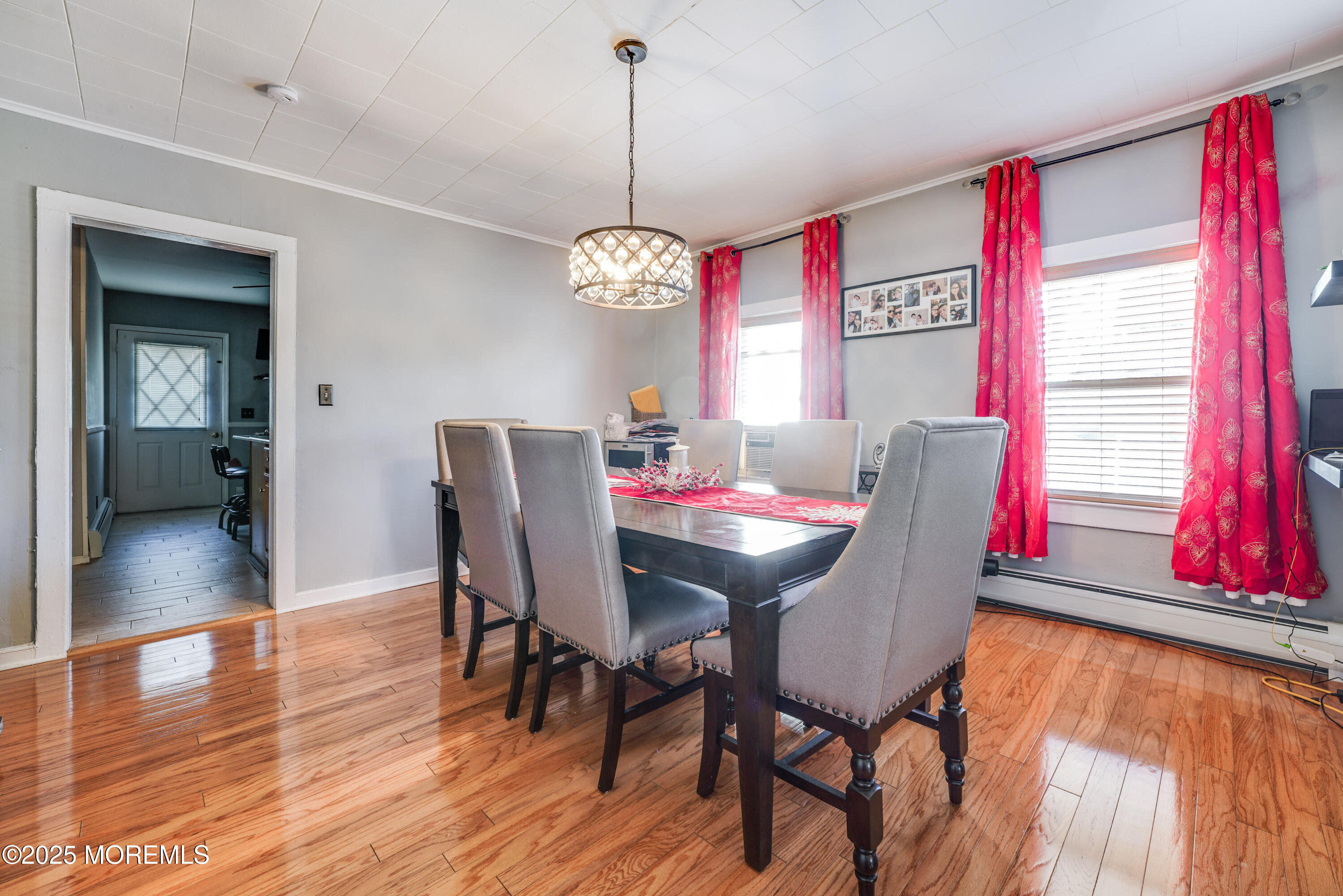 233 Broadway Union Beach, NJ 07735 - Photo 9 of 45 a view of a dining room with furniture window and wooden floor
