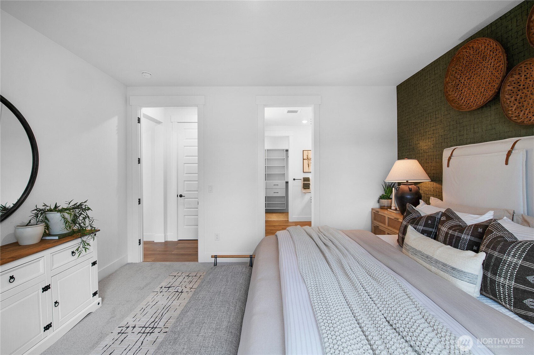 602 Gooseberry Place Sequim, WA 98382 - Photo 11 of 21 a bedroom with a bed and wooden floor