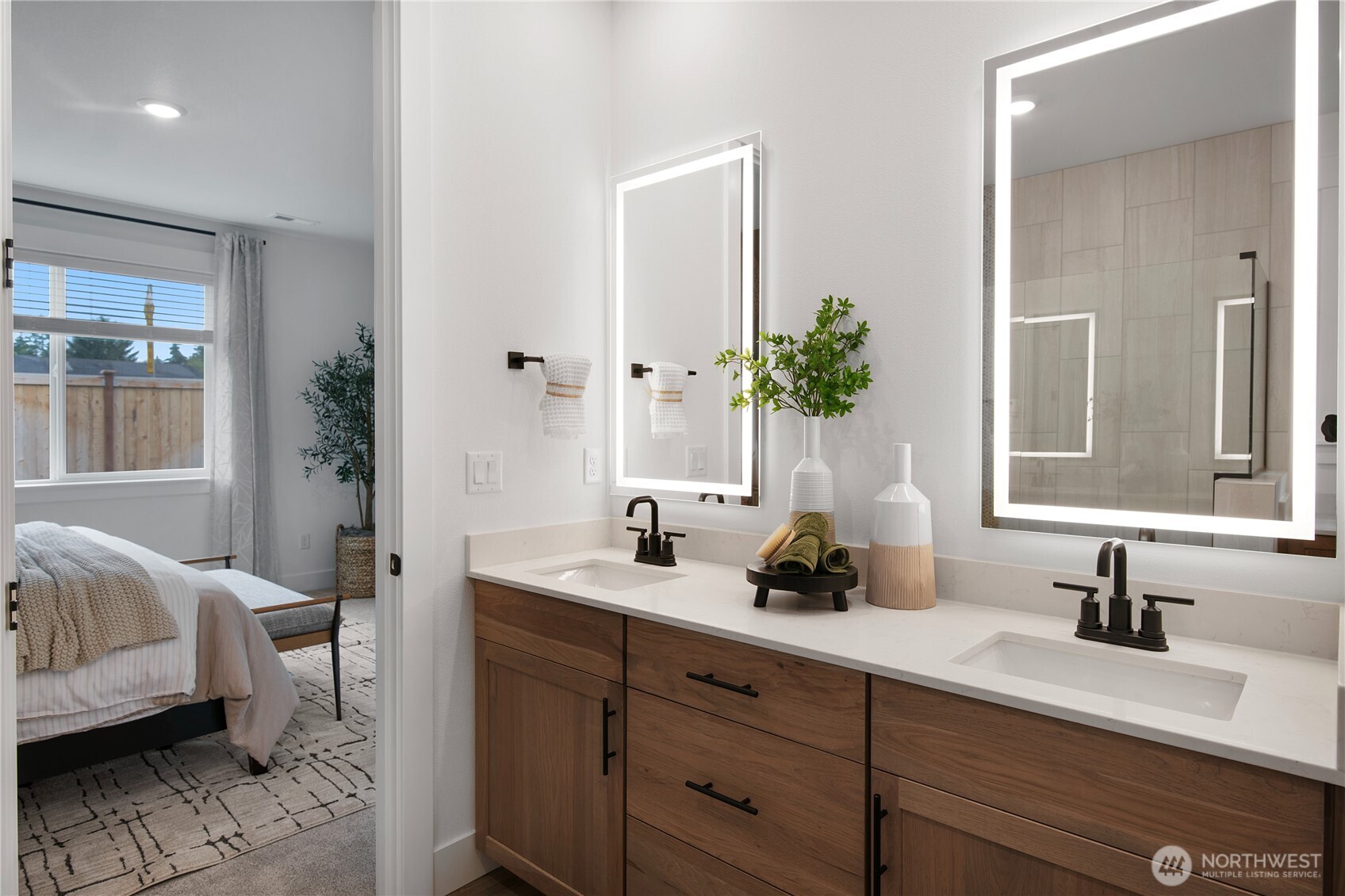 602 Gooseberry Place Sequim, WA 98382 - Photo 15 of 21 a bathroom with double vanity sink a window and a mirror