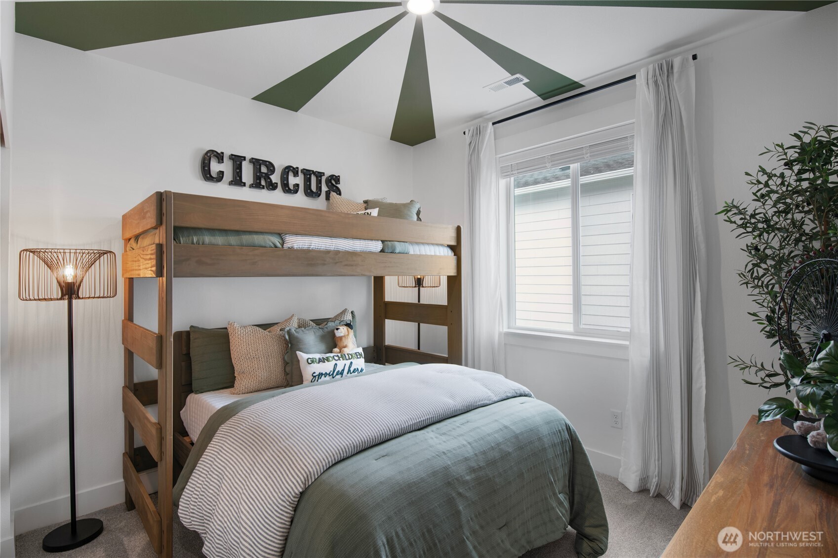 602 Gooseberry Place Sequim, WA 98382 - Photo 18 of 21 a bedroom with a bed and a potted plant