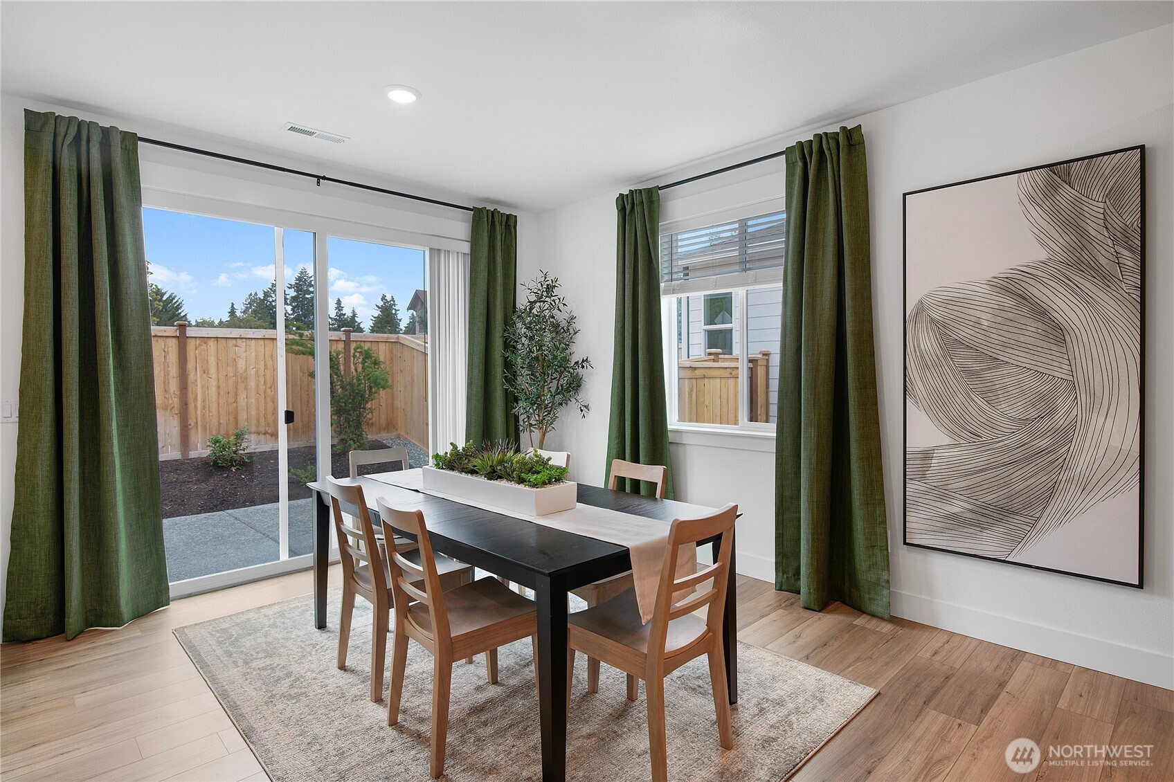602 Gooseberry Place Sequim, WA 98382 - Photo 6 of 21 a view of a dining room with furniture window and wooden floor