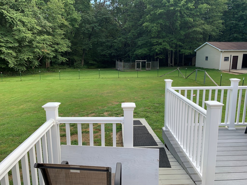 3870 Georgetown Road Polk, PA 16342 - Photo 15 of 42 a view of an house with backyard and deck