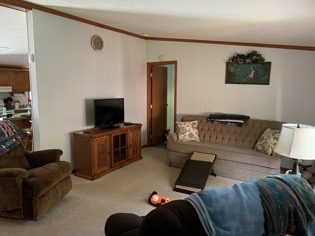 3870 Georgetown Road Polk, PA 16342 - Photo 24 of 42 a living room with furniture and a flat screen tv