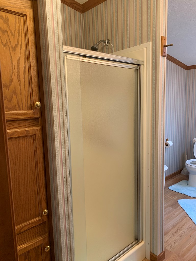3870 Georgetown Road Polk, PA 16342 - Photo 29 of 42 a view of a bathroom with a tub and mirror