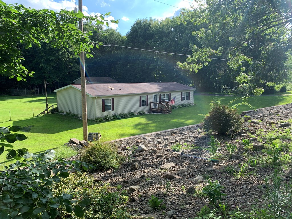 3870 Georgetown Road Polk, PA 16342 - Photo 3 of 42 a view of a house with a garden