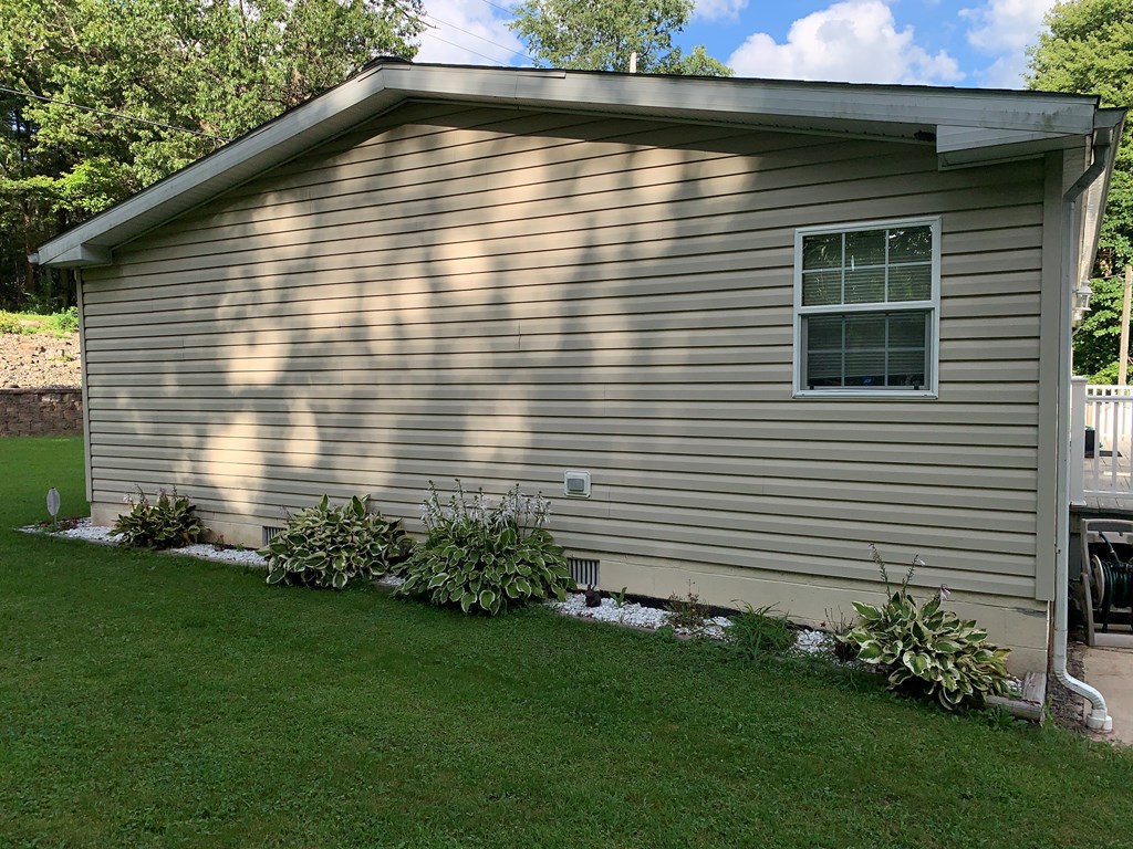 3870 Georgetown Road Polk, PA 16342 - Photo 5 of 42 a view of a backyard with plants and large trees