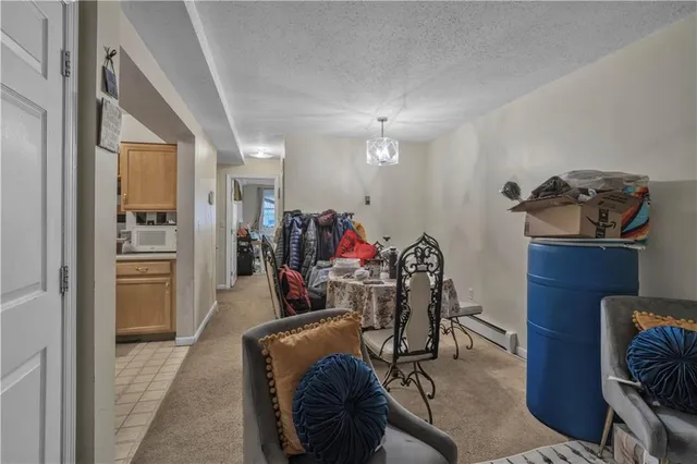 a view of a livingroom with furniture and workspace