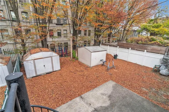 a view of a swimming pool with an outdoor seating