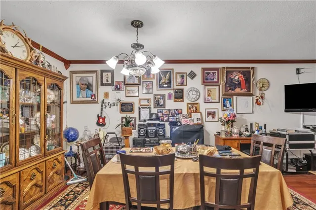a very nice looking living room with a large window and a flat screen tv