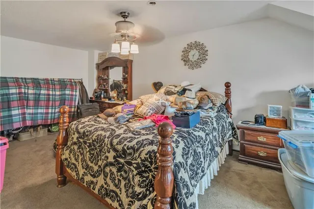 a bed room with a bed mirror and a window