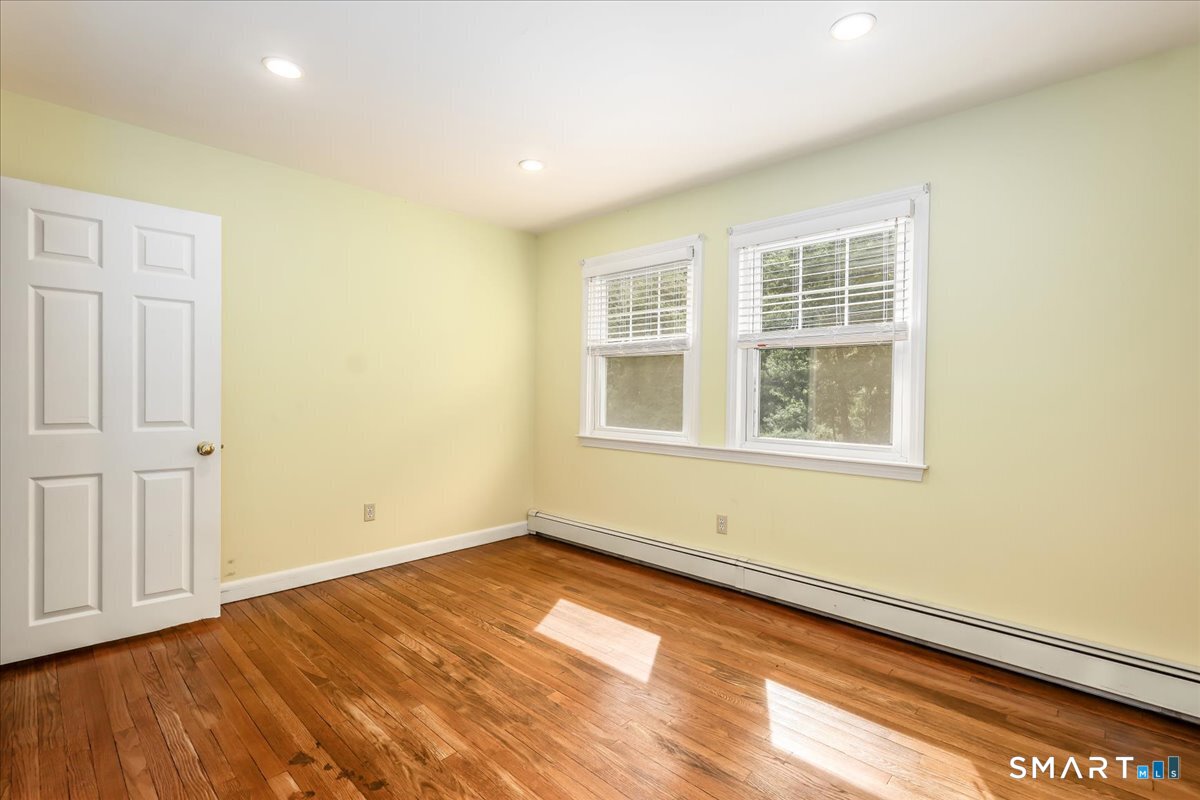 19 Botsford Hill Road Newtown, CT 06470 - Photo 29 of 40 an empty room with wooden floor and windows