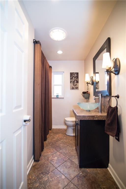 1032 Silver Lane McKees Rocks, PA 15136 - Photo 12 of 21 The updated full bath includes a ceramic tile floor.