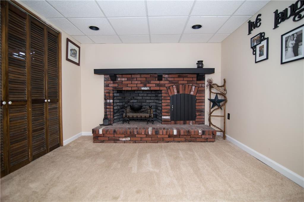 1032 Silver Lane McKees Rocks, PA 15136 - Photo 15 of 21 The basement also includes a decorative fireplace and laundry area.