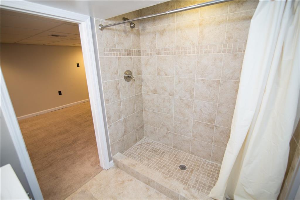 1032 Silver Lane McKees Rocks, PA 15136 - Photo 17 of 21 The basement also includes a full bath with a tiled shower.