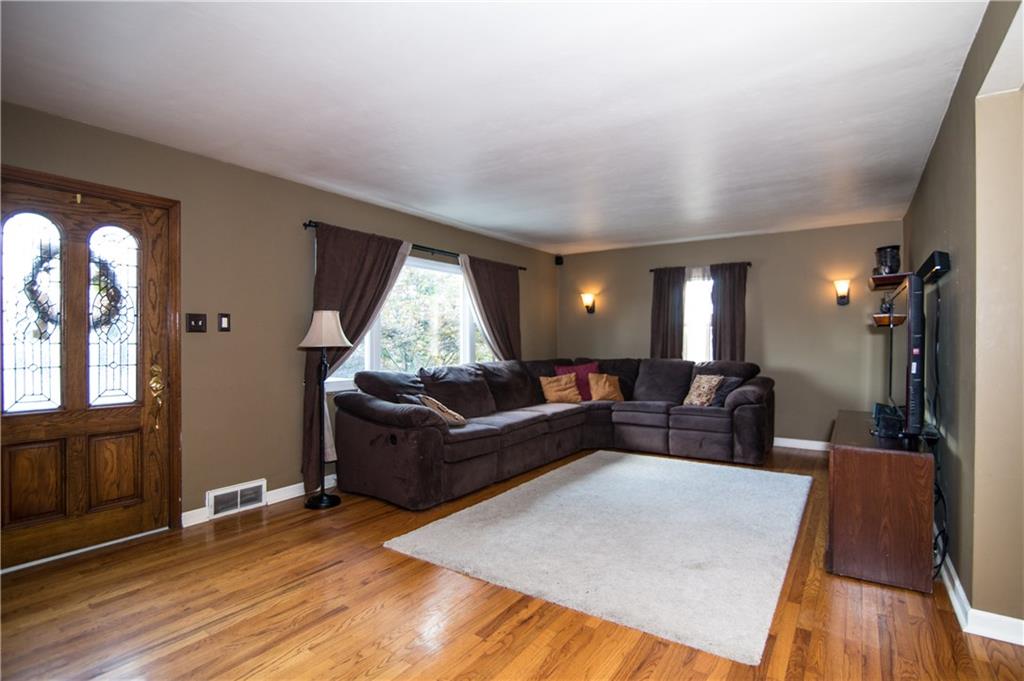 1032 Silver Lane McKees Rocks, PA 15136 - Photo 3 of 21 The warm and inviting living room includes hardwood floors.