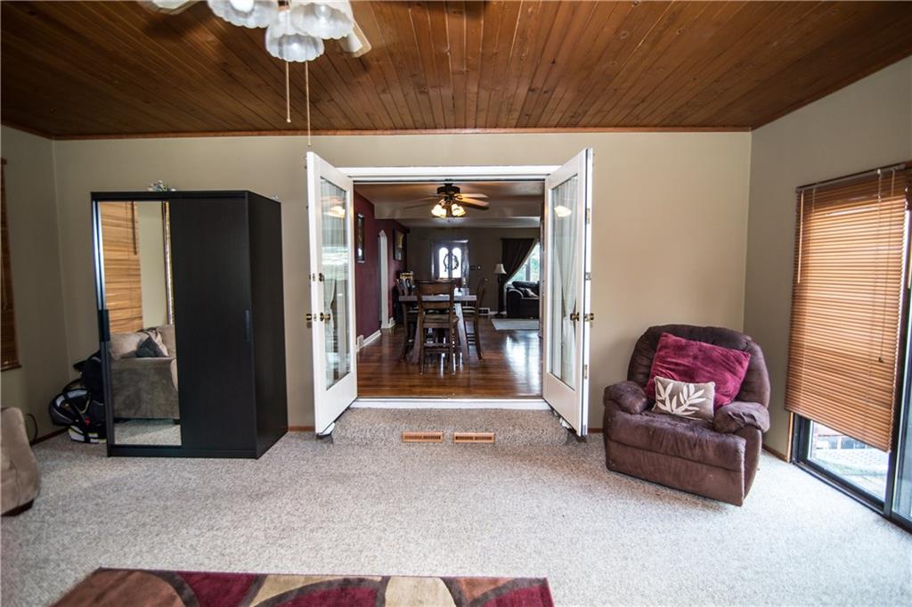 1032 Silver Lane McKees Rocks, PA 15136 - Photo 8 of 21 The family room includes a knotty pine ceiling and French doors that lead to the dining room. A sliding glass door leads to the patio.