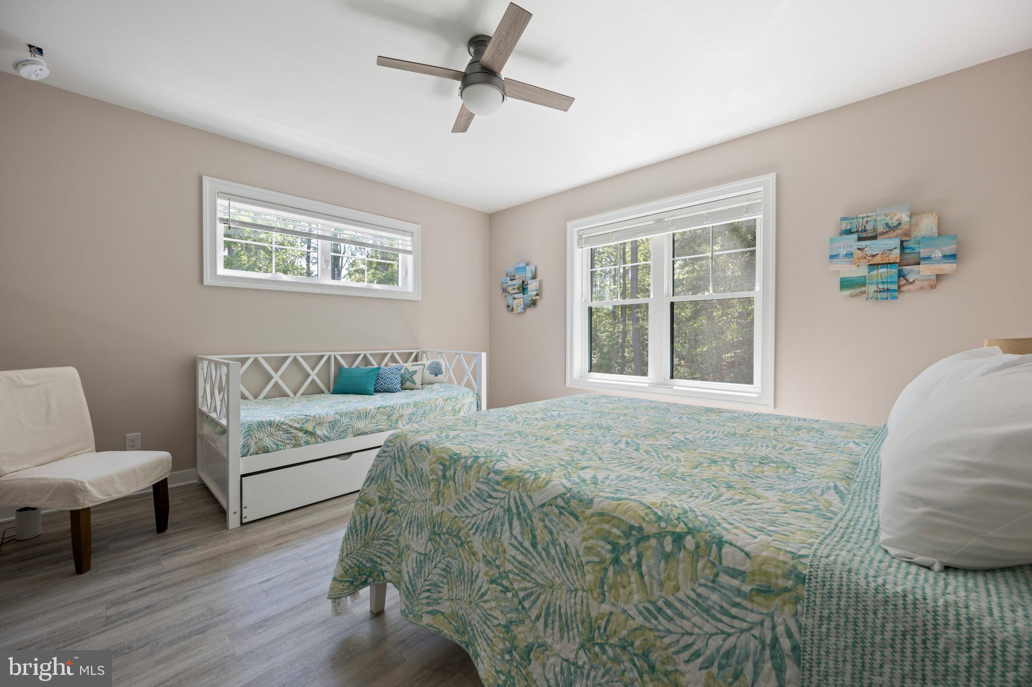 402 Salt Pond Road Bethany Beach, DE 19930 - Photo 32 of 55 Serene bedroom with nature views.