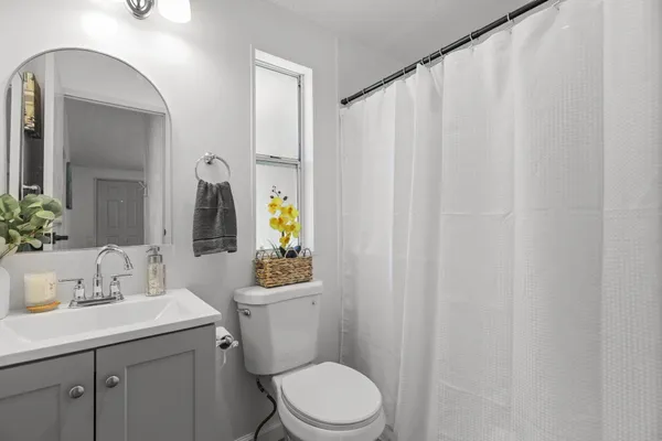 a view of a kitchen with a sink and a window
