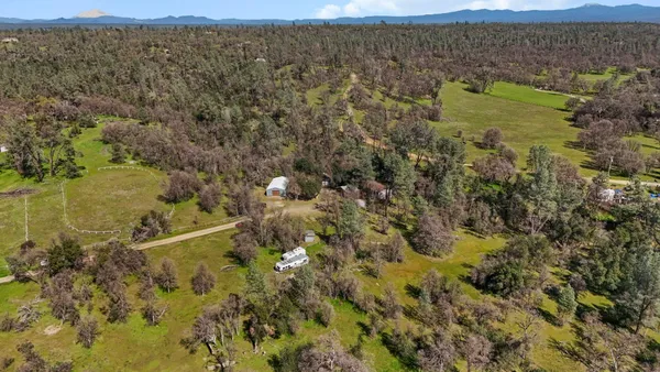 a aerial view of a house with a yard