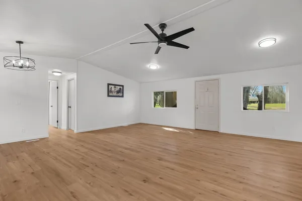 a bathroom with a toilet sink vanity and mirror