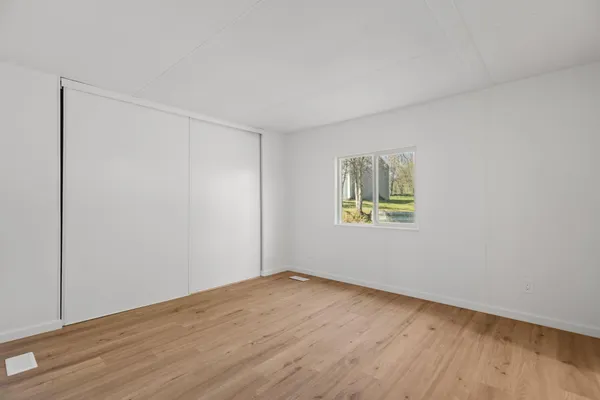 a view of an empty room with a utility room