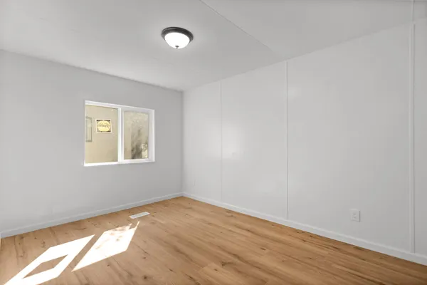 a front view of house with deck and yard