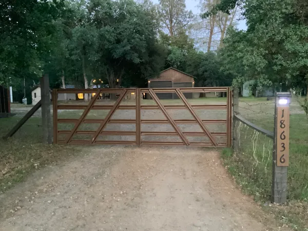 a view of empty room with wooden floor and window