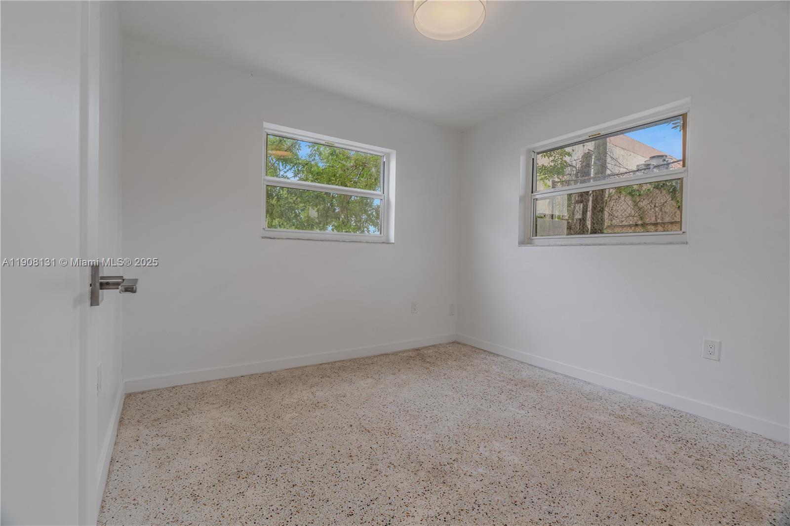 421 Southwest 9th Street, Unit 3 Miami, FL 33130 - Photo 7 of 10 an empty room with a window
