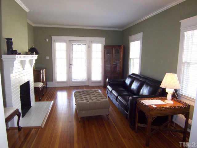 1708 Dare Street Raleigh, NC 27608 - Photo 2 of 9 a living room with furniture and a fireplace