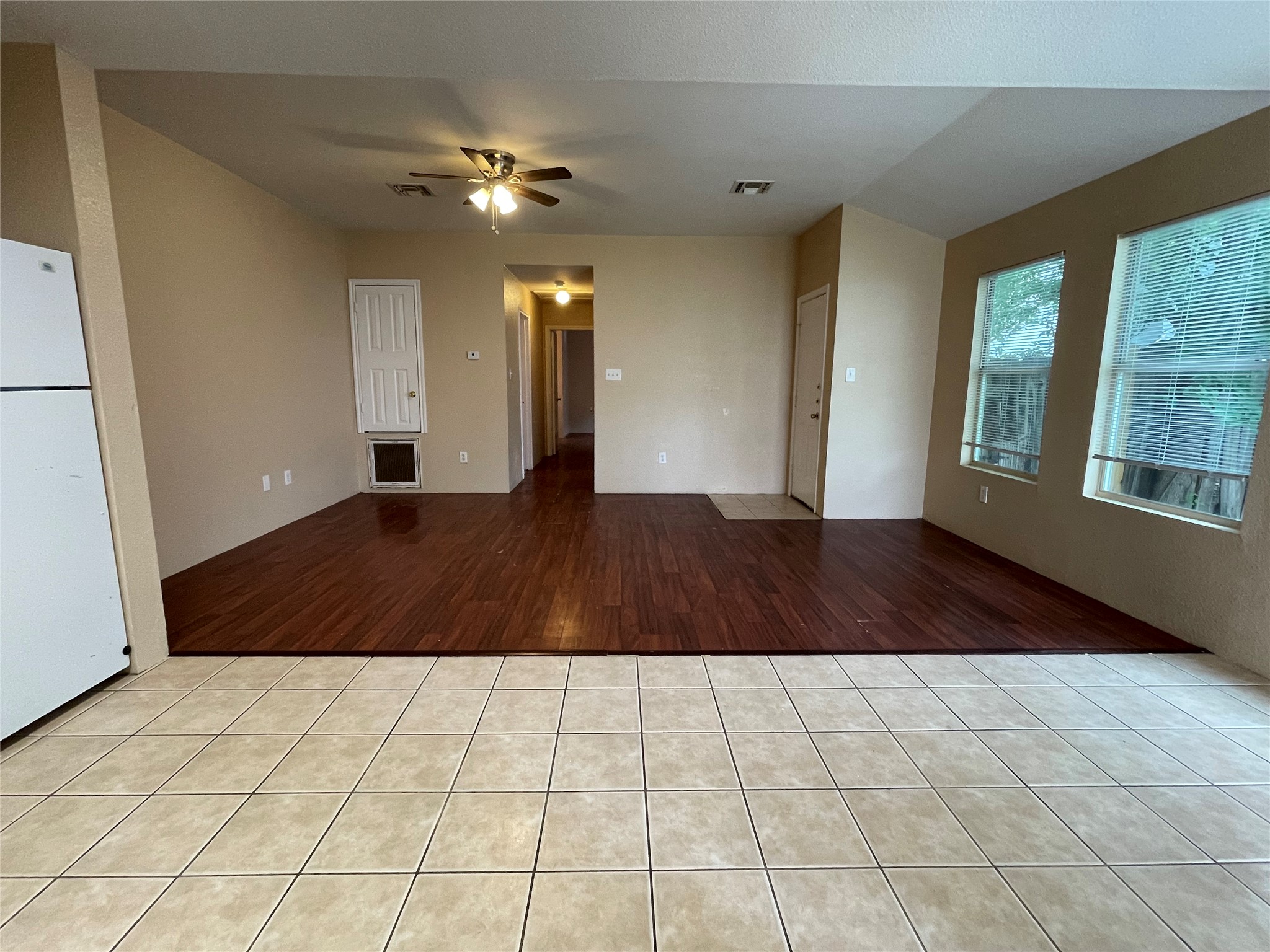 11241 Terra Loop Road San Antonio, TX 78233 - Photo 3 of 5 A versatile living space with distinct flooring zones and multiple entryways.