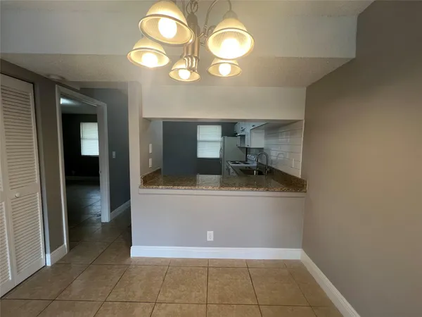 a kitchen with a stove sink and refrigerator