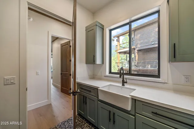 a bathroom with 2 sink and a mirror