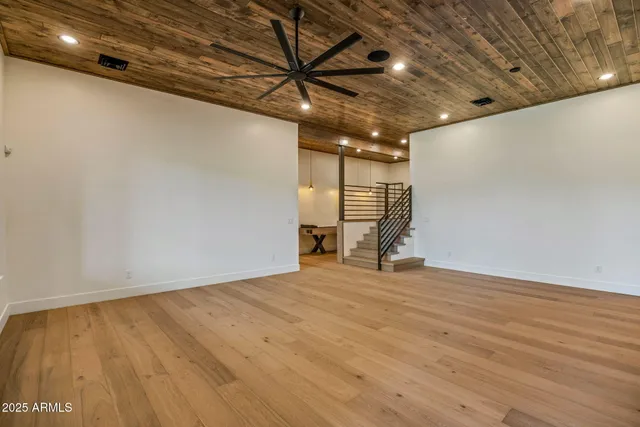 a front view of a house with a tree