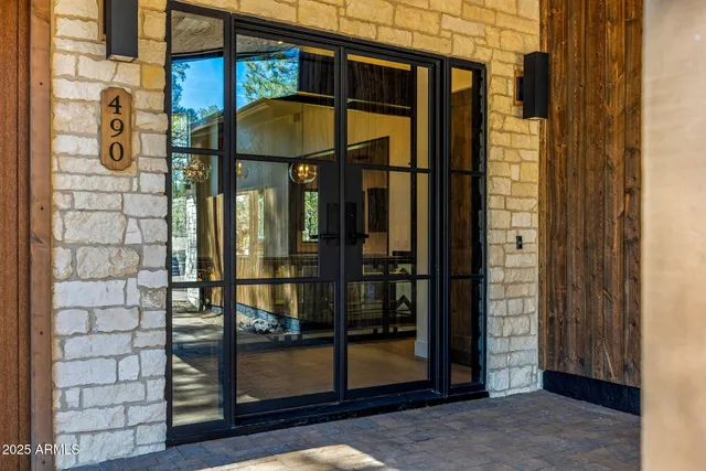 a kitchen with stainless steel appliances granite countertop a sink a stove and cabinets