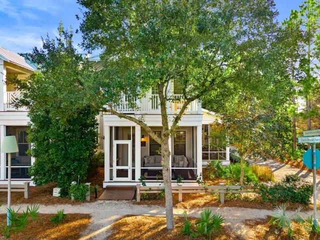 a living room with couch and a large window