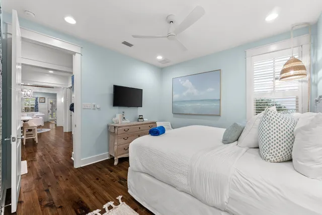 a bedroom with a bed and flat screen tv