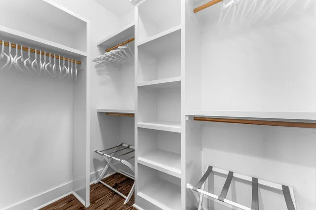 an aerial view of a house with a garden and trees