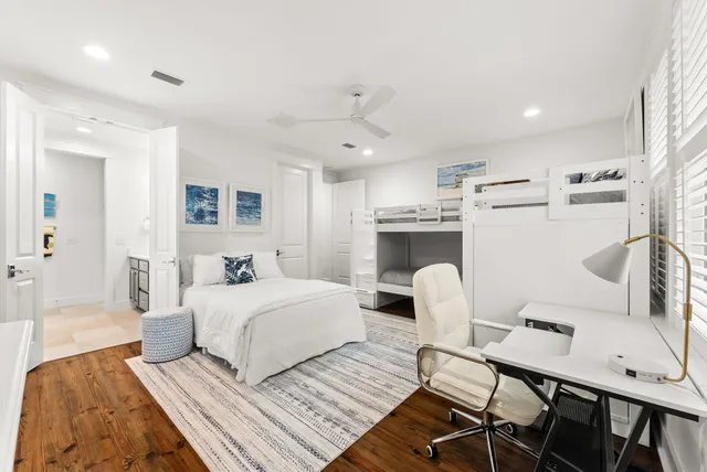 an aerial view of residential houses and car parked